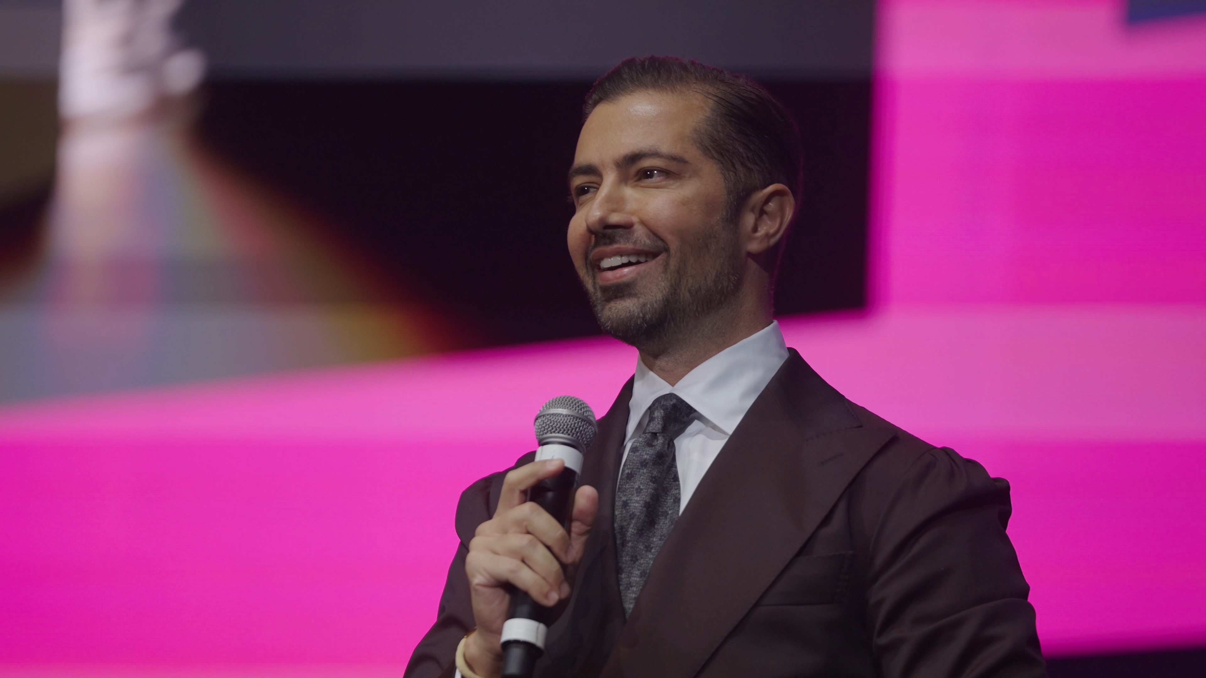 Sandro Cazzato speaking on stage